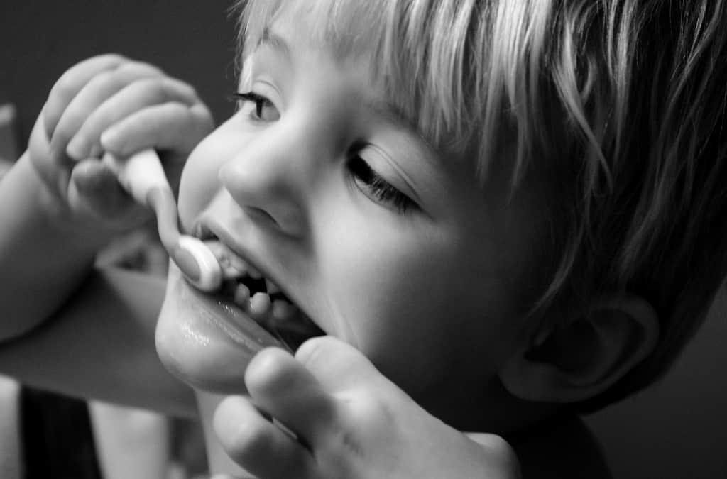 Kid brushing teeth